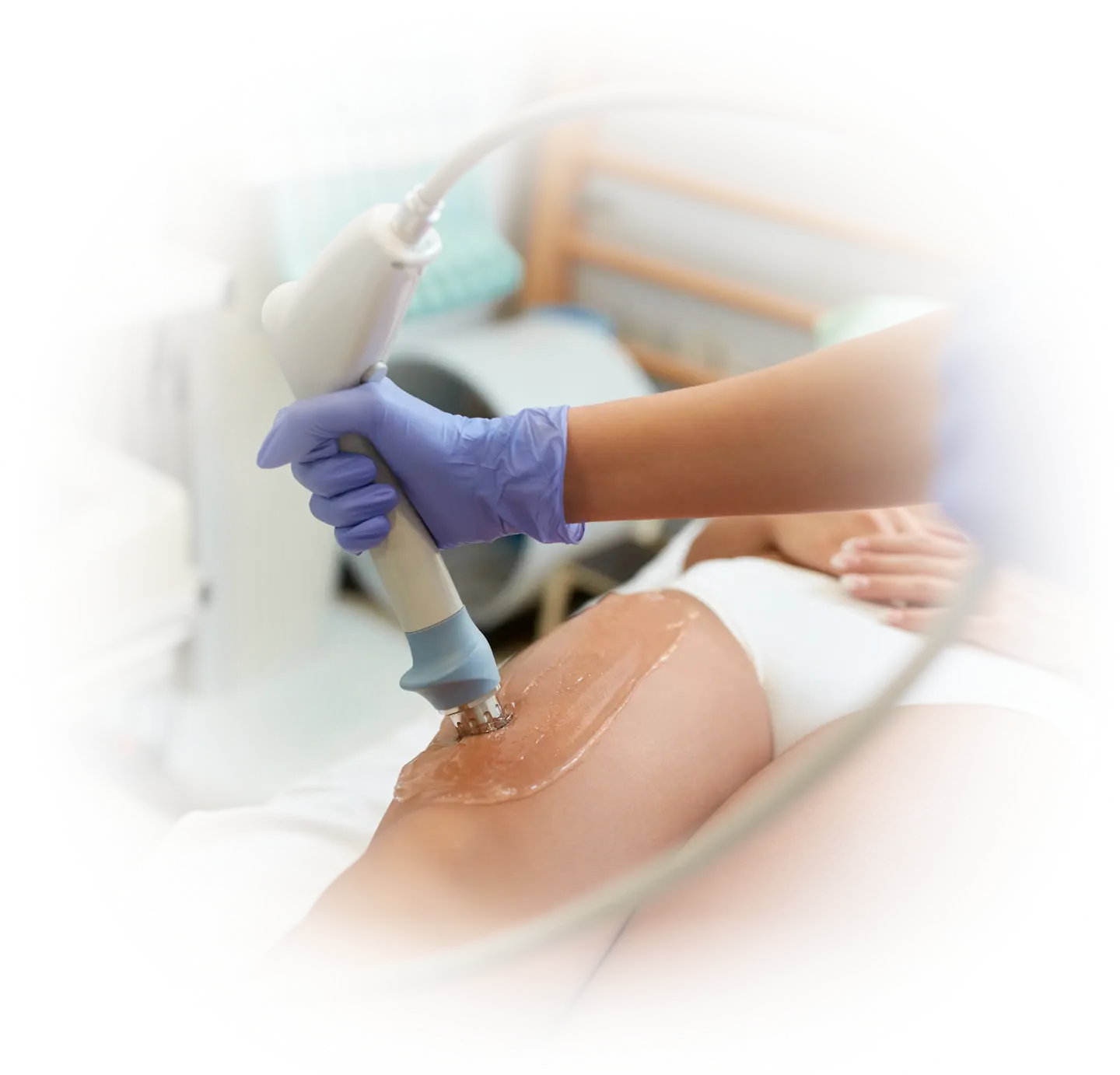 Medical professional applying shockwave therapy to a patient’s leg, representing non-invasive treatment for musculoskeletal injuries and improved mobility at Gallant Lion Medical